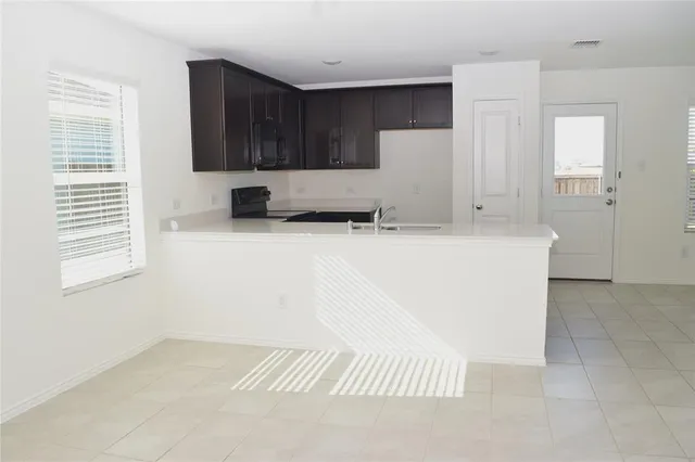 a view of a kitchen with a sink
