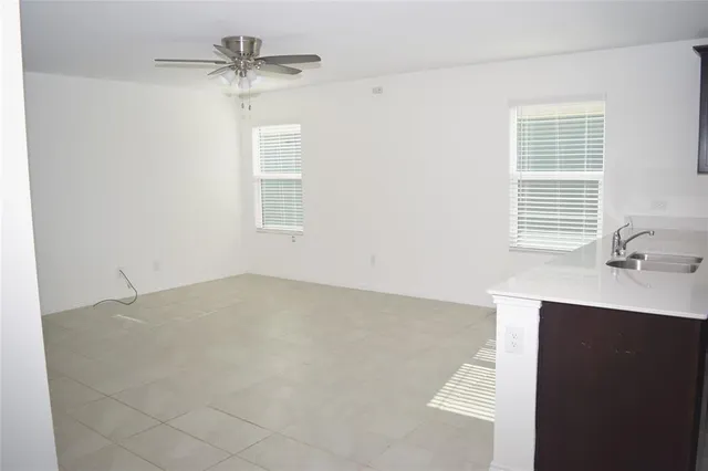 a view of a kitchen with a sink cabinet and a fireplace