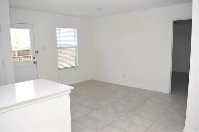 a white bath tub sitting next to a white toilet