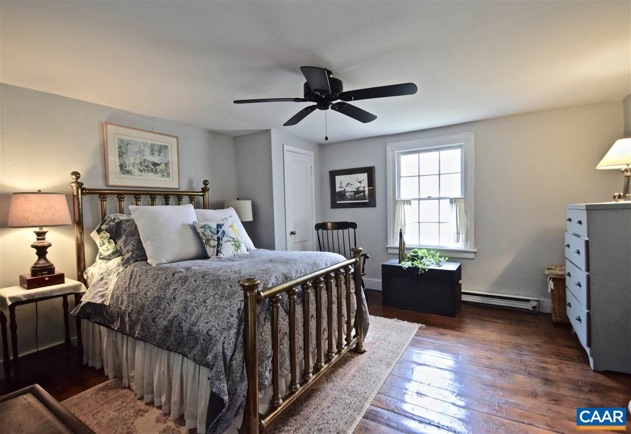 237 Campbell Road Keswick, VA 22947 - Photo 24 of 41 a bed room with a bed and a window