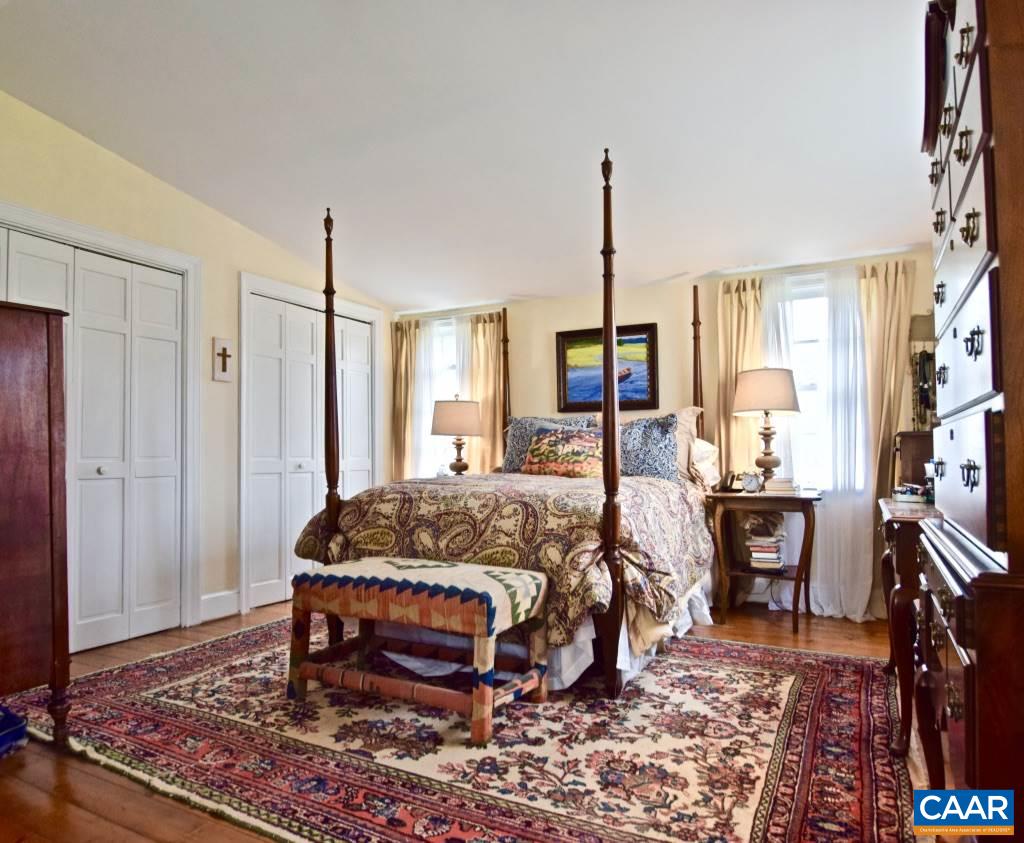 237 Campbell Road Keswick, VA 22947 - Photo 27 of 41 a bed room with a bed window and a table