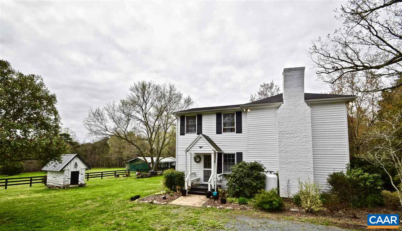 237 Campbell Road Keswick, VA 22947 - Photo 35 of 41 a front view of a house with a yard