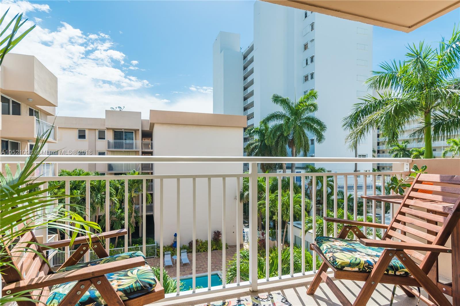 a view of a balcony with chairs