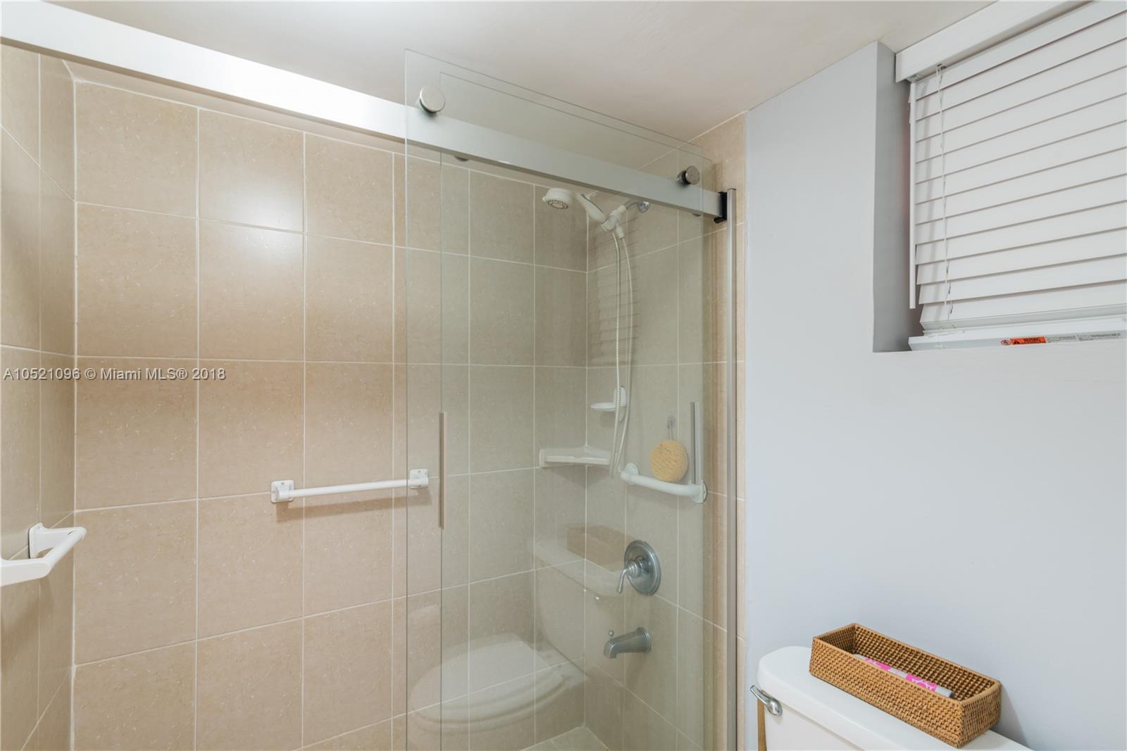 1665 Bay Road, Unit 425 Miami Beach, FL 33139 - Photo 14 of 15 a bathroom with a shower and a sink