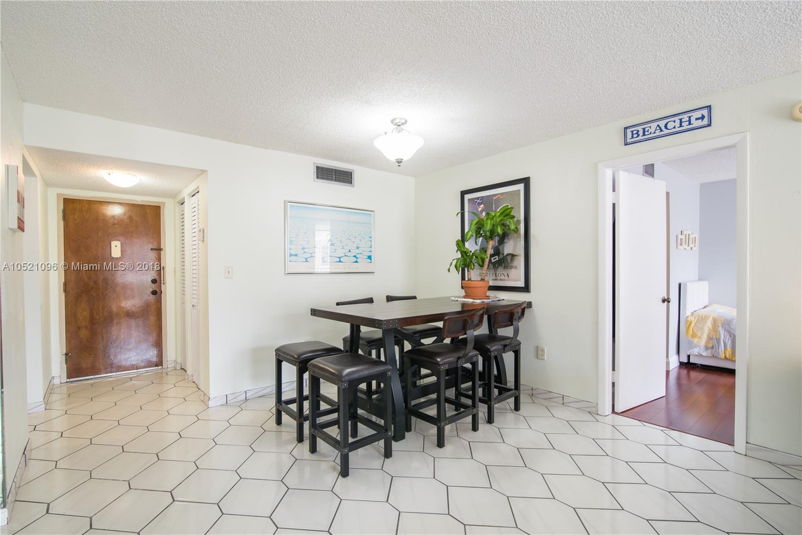 1665 Bay Road, Unit 425 Miami Beach, FL 33139 - Photo 6 of 15 a view of a dining room with furniture