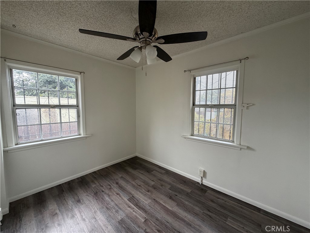 5425 2nd Avenue, Unit 3/4 Los Angeles, CA 90043 - Photo 14 of 15 an empty room with wooden floor fan and windows