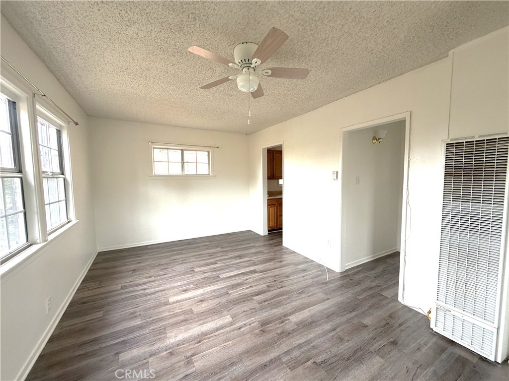 5425 2nd Avenue, Unit 3/4 Los Angeles, CA 90043 - Photo 2 of 15 a view of an empty room with wooden floor and a window