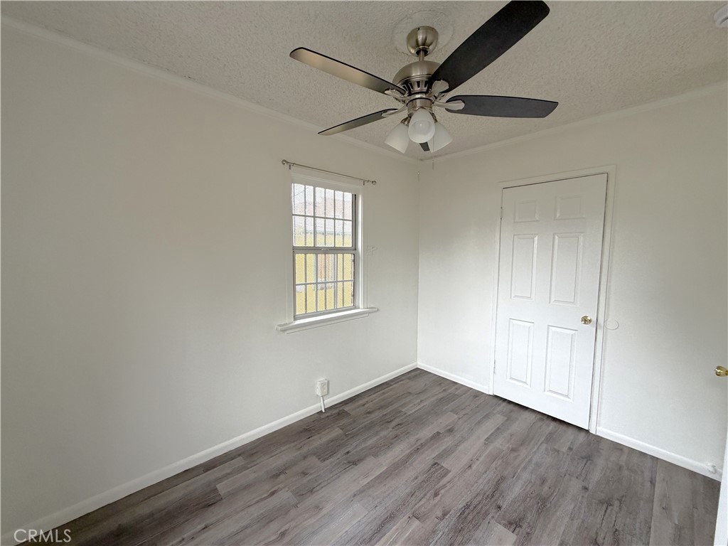 5425 2nd Avenue, Unit 3/4 Los Angeles, CA 90043 - Photo 10 of 15 an empty room with wooden floor fan and windows