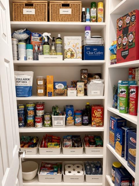 700 Sharon Road Copiague, NY 11726 - Photo 12 of 27 a shelf with cup and plates