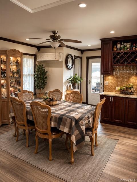 700 Sharon Road Copiague, NY 11726 - Photo 13 of 27 a view of a dining room with furniture window and wooden floor