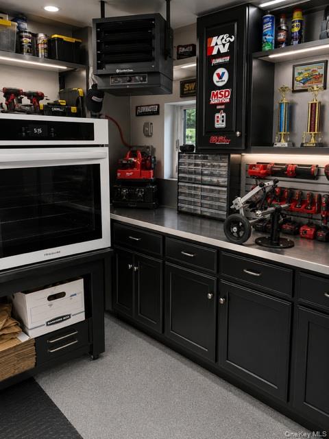 700 Sharon Road Copiague, NY 11726 - Photo 26 of 27 a kitchen with stainless steel appliances kitchen island granite countertop a stove and a microwave