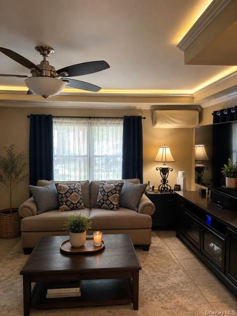 700 Sharon Road Copiague, NY 11726 - Photo 4 of 27 a living room with furniture and a flat screen tv