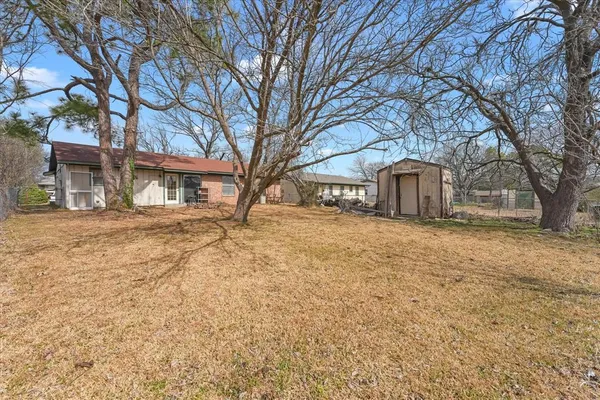 a house with trees in front of it