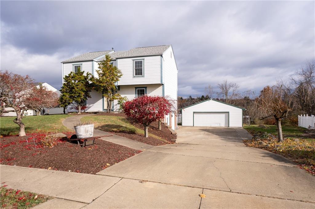 7324 Green Meadow Drive Imperial, PA 15126 - Photo 2 of 43 a view of a street with houses