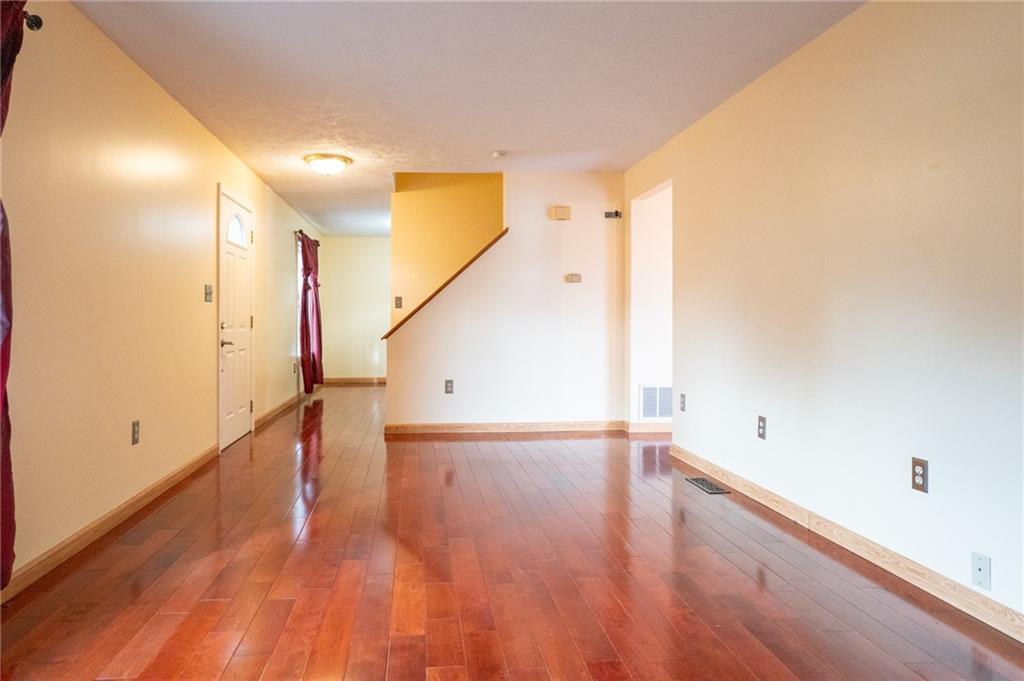 7324 Green Meadow Drive Imperial, PA 15126 - Photo 3 of 43 a view of an empty room with wooden floor