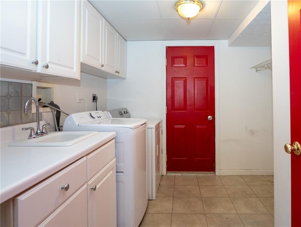 7324 Green Meadow Drive Imperial, PA 15126 - Photo 31 of 43 a utility room with dryer and washer