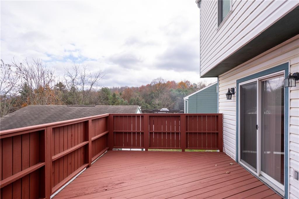 7324 Green Meadow Drive Imperial, PA 15126 - Photo 35 of 43 a view of a deck with wooden floor and fence next to a yard