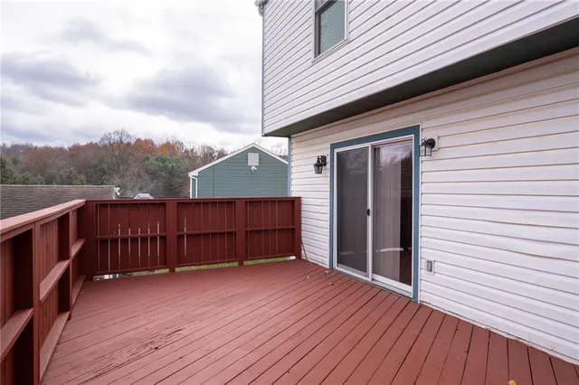 a view of a terrace with wooden walls
