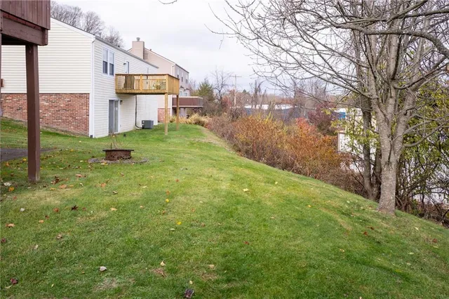 a view of a backyard of the house