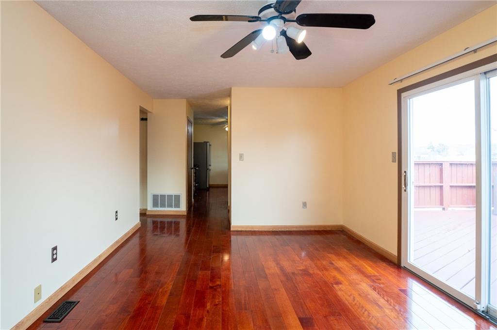 7324 Green Meadow Drive Imperial, PA 15126 - Photo 8 of 43 a view of empty room with wooden floor and fan