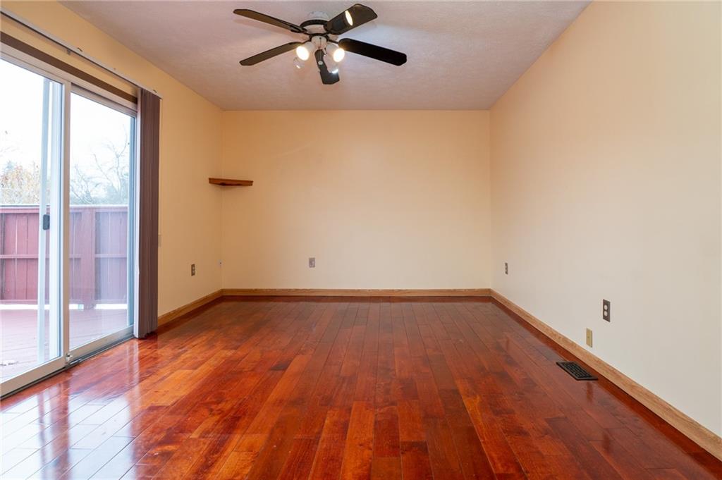 7324 Green Meadow Drive Imperial, PA 15126 - Photo 10 of 43 a view of a big room with wooden floor and windows in a room