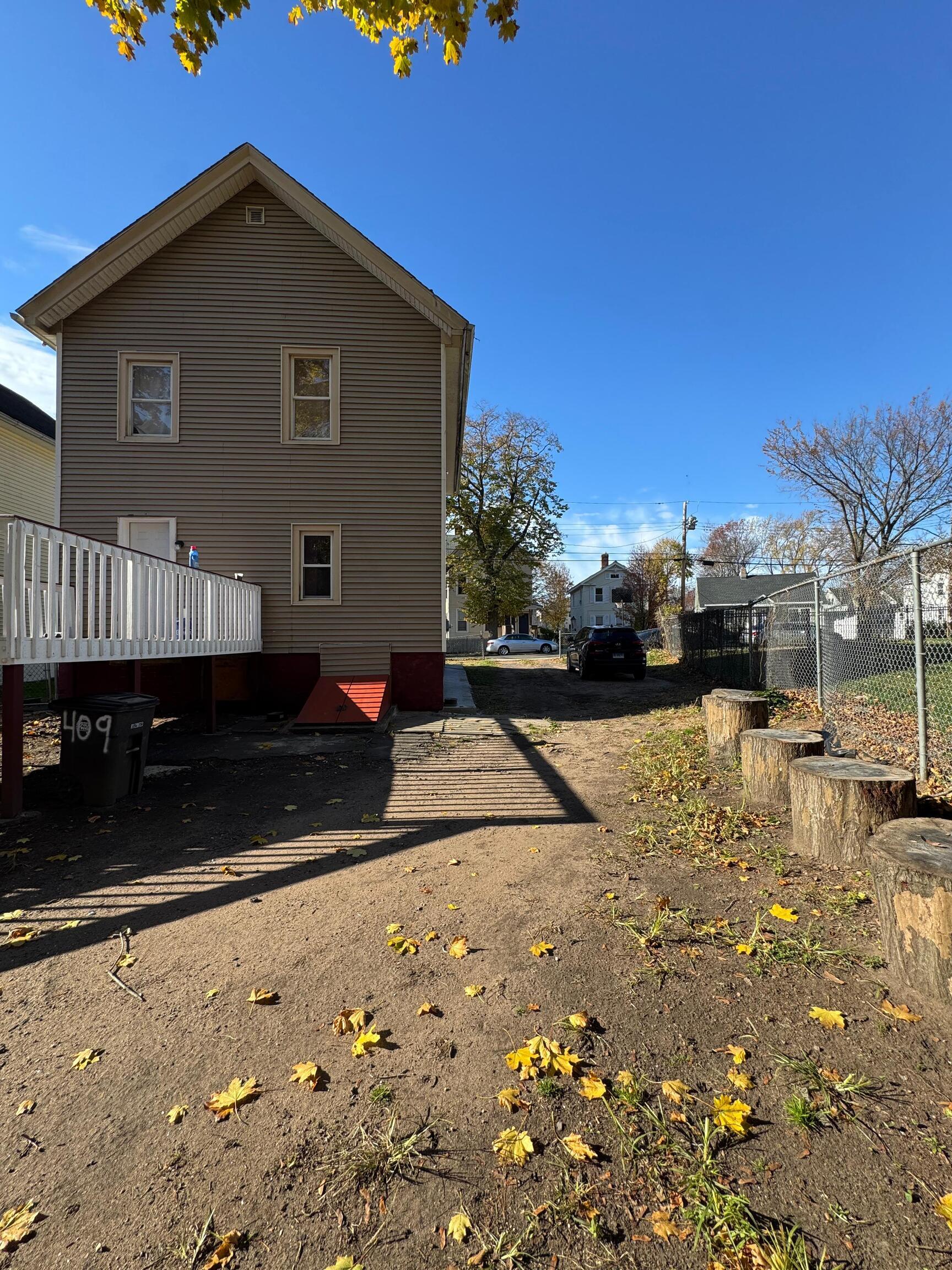 409 Poplar Street New Haven, CT 06513 - Photo 14 of 14 a view of a house with wooden fence