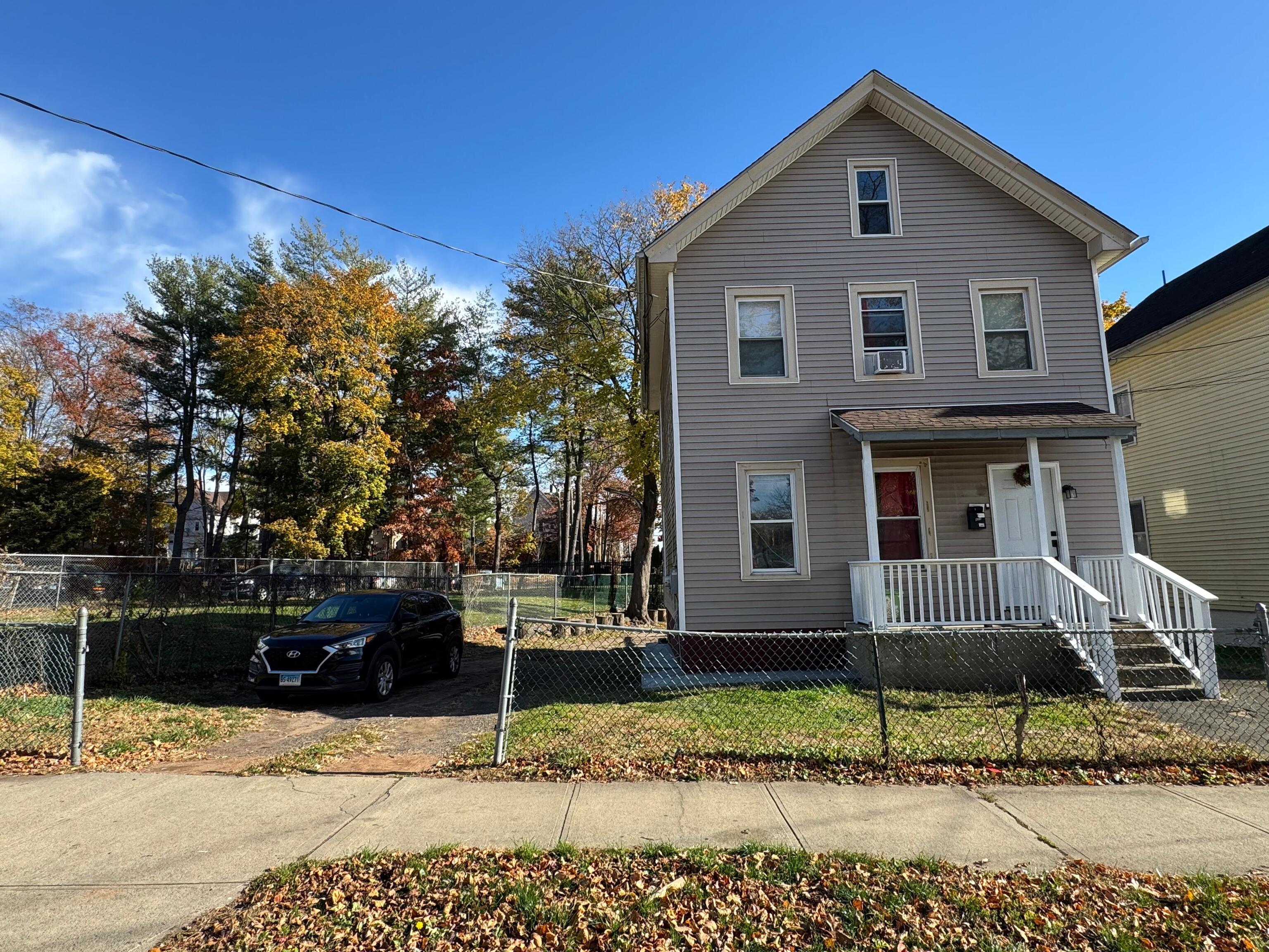 409 Poplar Street New Haven, CT 06513 - Photo 2 of 14 a front view of a house with a yard