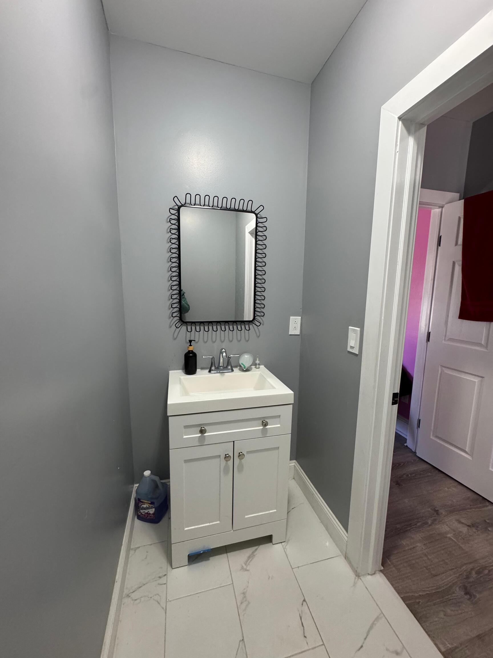 409 Poplar Street New Haven, CT 06513 - Photo 7 of 14 a bathroom with a sink and a mirror