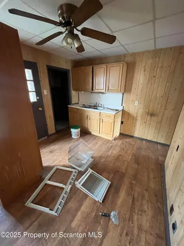 a room with pool table and a chandelier