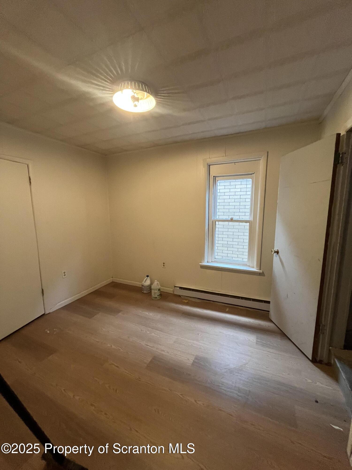 219 Ash Street Scranton, PA 18509 - Photo 6 of 11 an empty room with windows