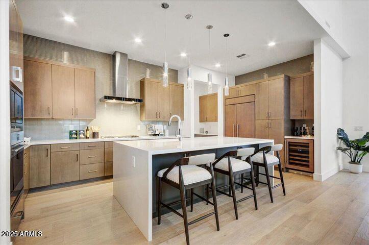 100 West Northern Avenue, Unit 4 Phoenix, AZ 85021 - Photo 3 of 25 a kitchen with kitchen island granite countertop wooden cabinets a counter top space and stainless steel appliances