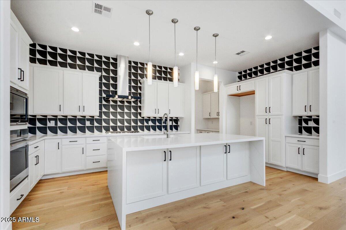 100 West Northern Avenue, Unit 4 Phoenix, AZ 85021 - Photo 5 of 25 a kitchen with white cabinets and black appliances