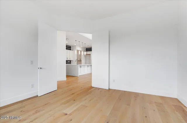 a view of a kitchen with wooden floor
