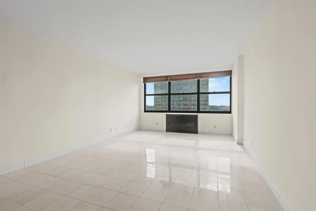 a view of a room with a large window