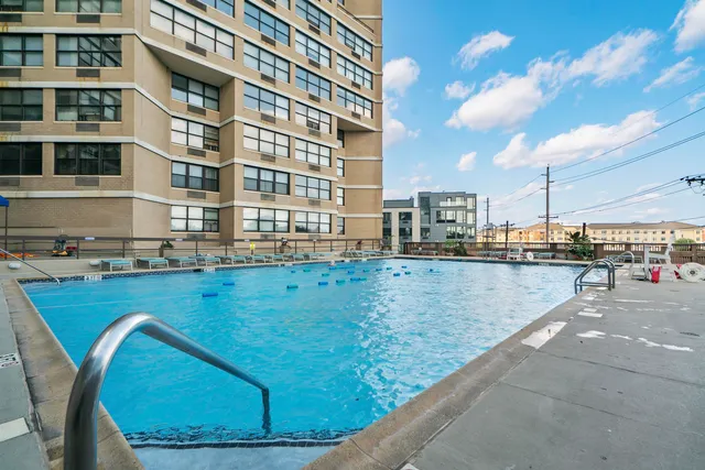 a view of a swimming pool yard and patio