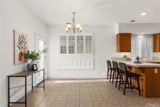 a view of a dining room with furniture and window