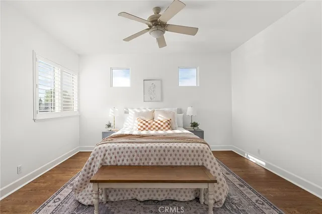 a bedroom with a bed and dresser