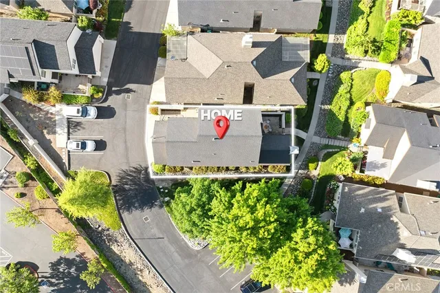 an aerial view of a house with a yard and garden