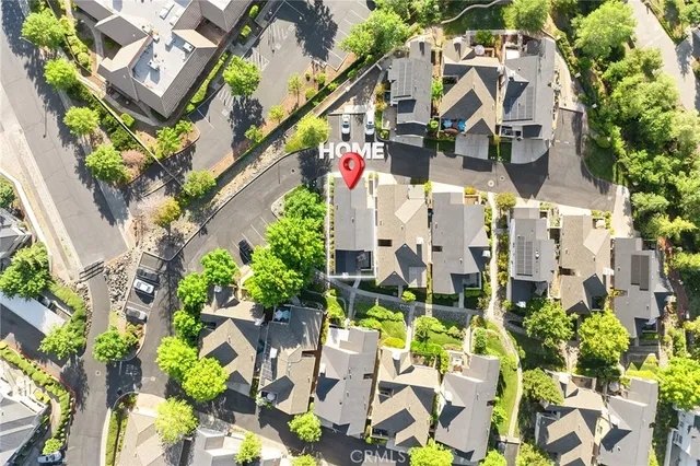 an aerial view of residential building with green space