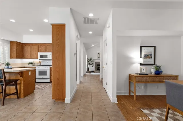 a view of a kitchen and kitchen island hardwood floor and a sink