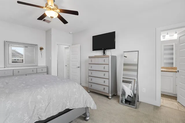 a bedroom with a bed and flat screen tv