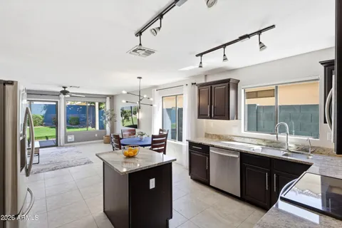 a kitchen with a refrigerator a kitchen island a stove and a refrigerator