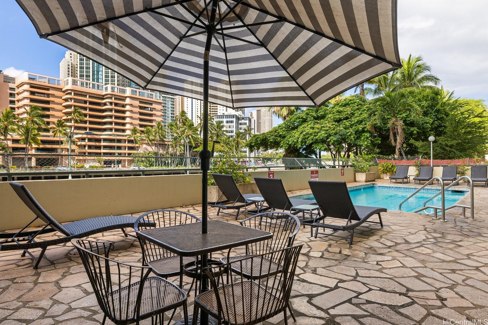 620 McCully Street, Unit 703 Honolulu, HI 96826 - Photo 18 of 25 There's a nice place to gather and sun bathe here.
