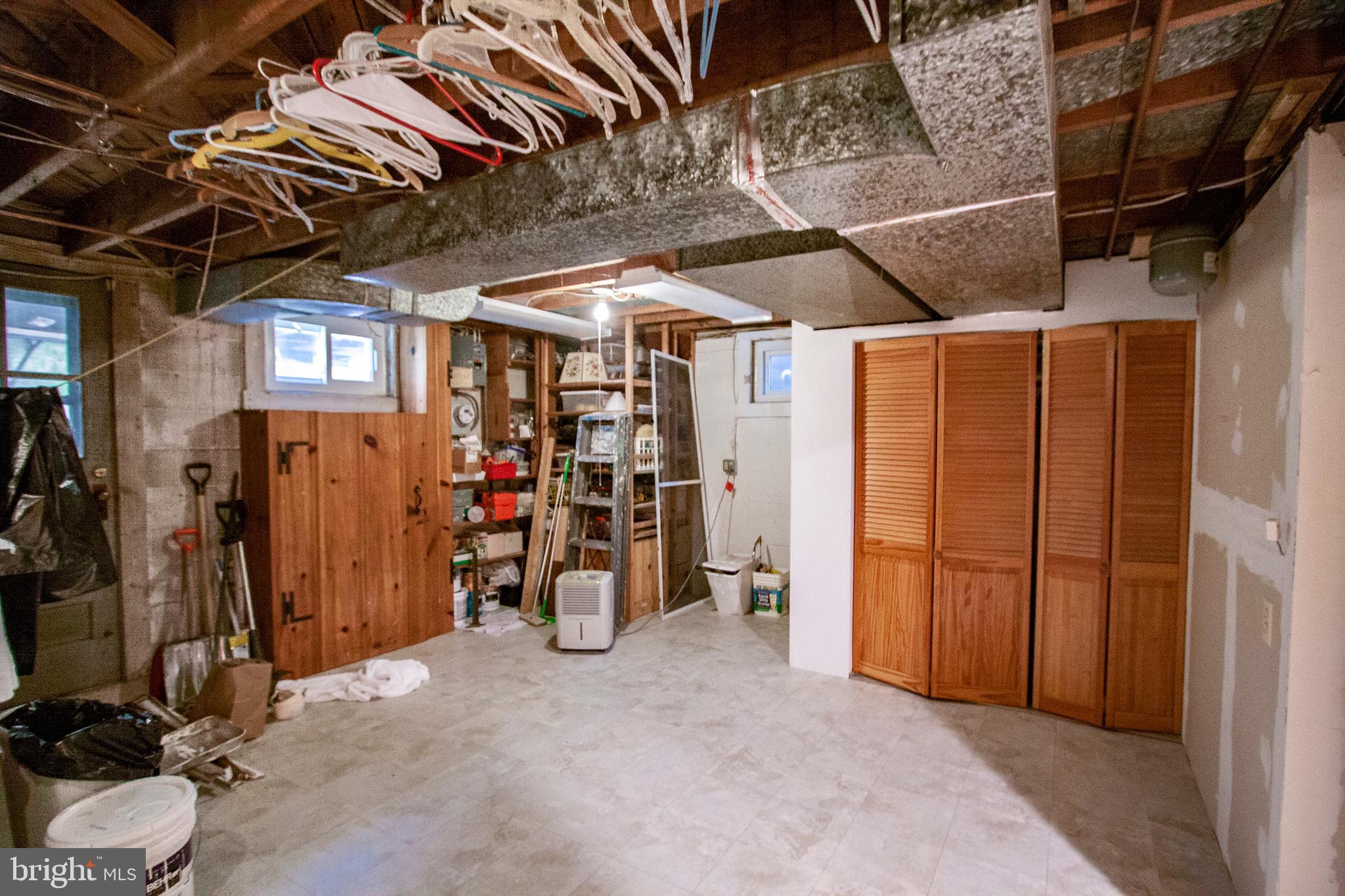 7225 Lanark Road Baltimore, MD 21212 - Photo 47 of 60 HVAC and Water Tank Heater behind bi-fold doors