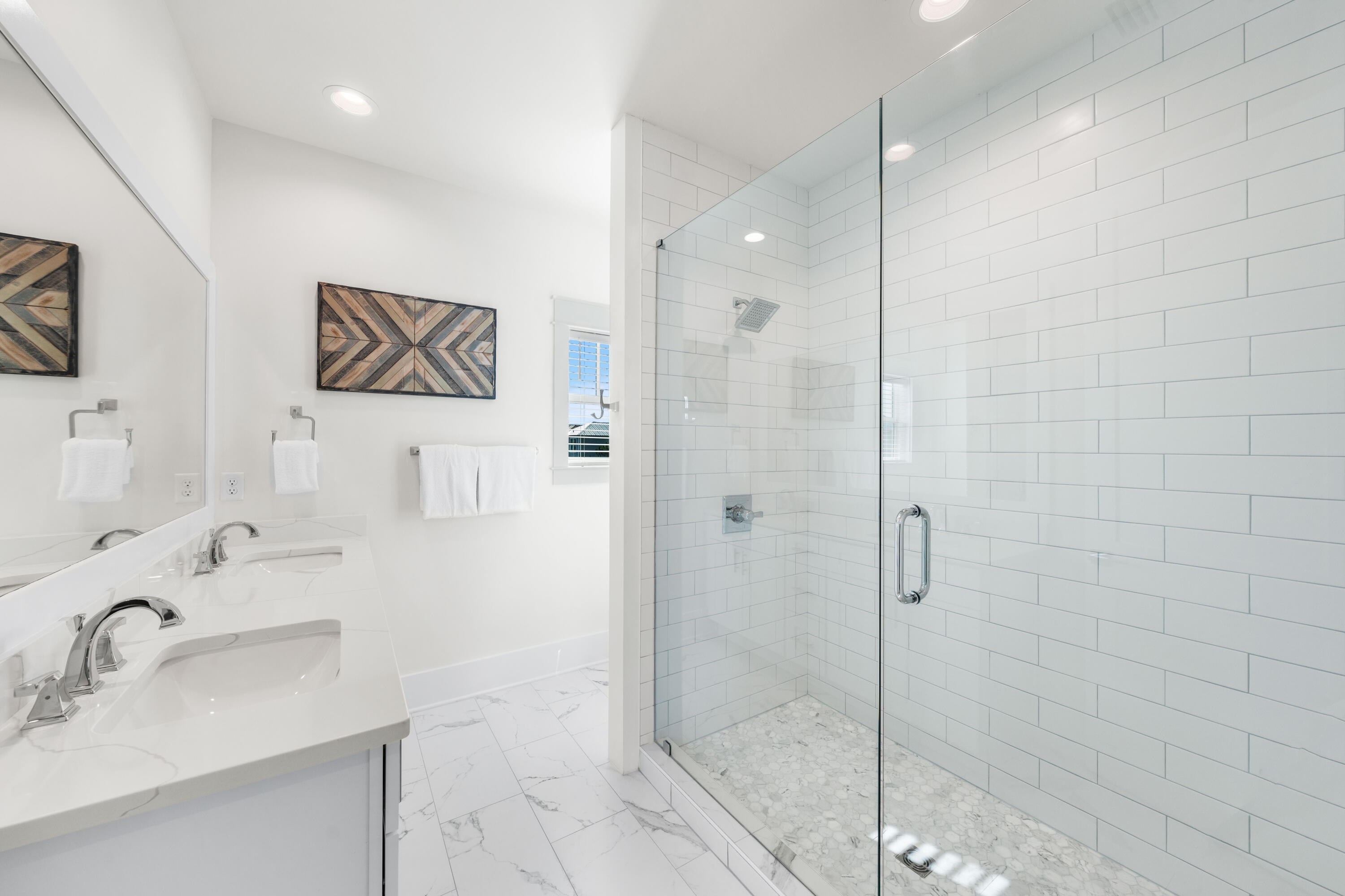 75 Sawgrass Lane Santa Rosa Beach, FL 32459 - Photo 28 of 39 a bathroom with a shower sink vanity and mirror