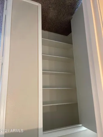 en empty room with windows