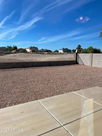 a view of a swimming pool and an outdoor seating
