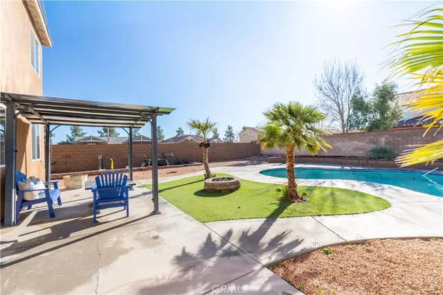 a view of swimming pool with a patio