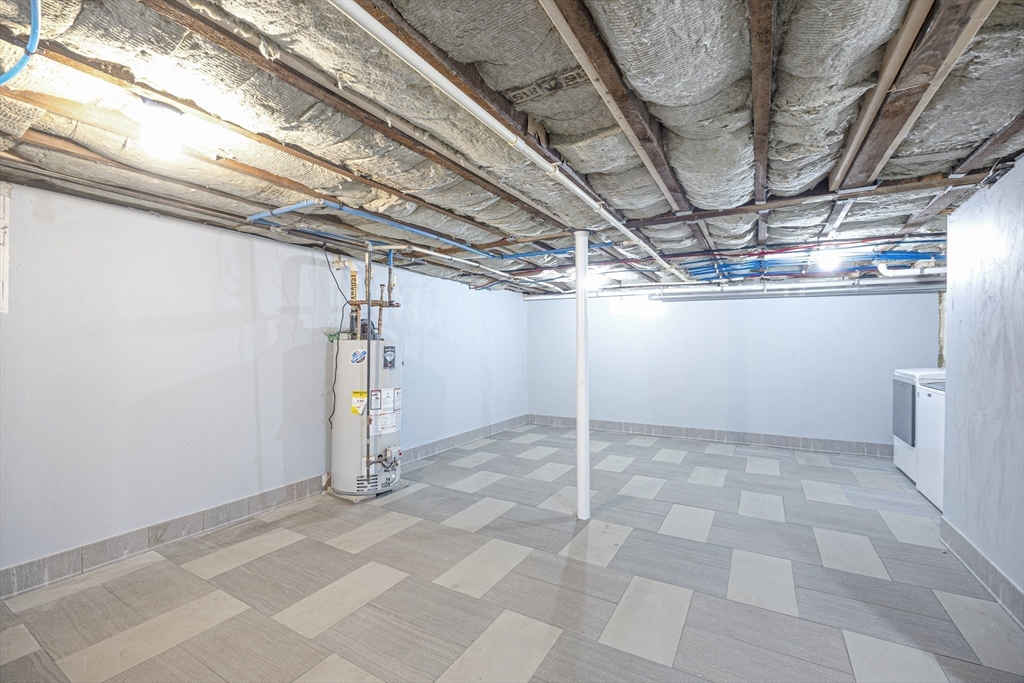 48 Spruce Street, Unit 1 Winchester, MA 01890 - Photo 24 of 29 a view of a room with wooden walls