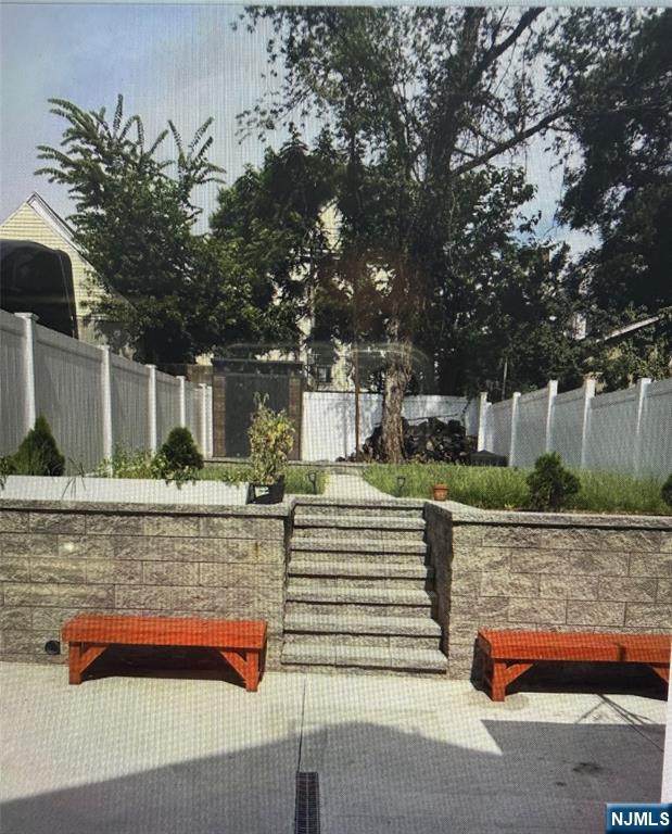 149 Camden Street Newark, NJ 07103 - Photo 3 of 3 a front view of a house with a yard